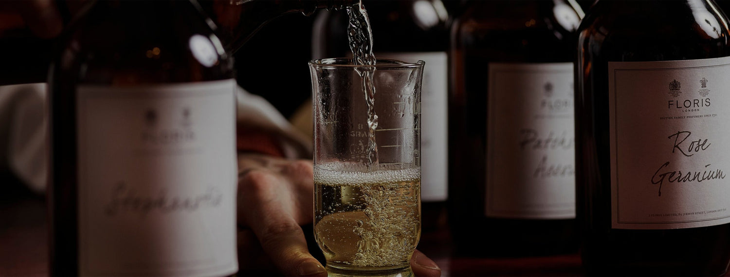 Pouring fragrance into glass vial