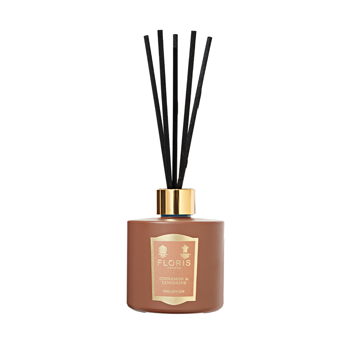 Floris London Cinnamon & Tangerine Reed Diffuser features a brown bottle with black reeds and gold label, offering a rich, room-filling fragrance.