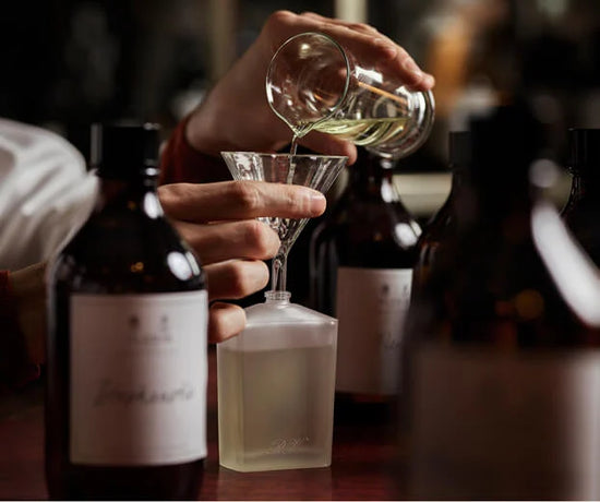 Pouring replenishment into glass bottle