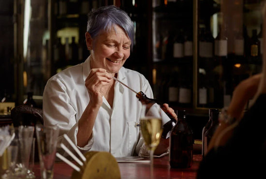 Perfumer mixing perfume 