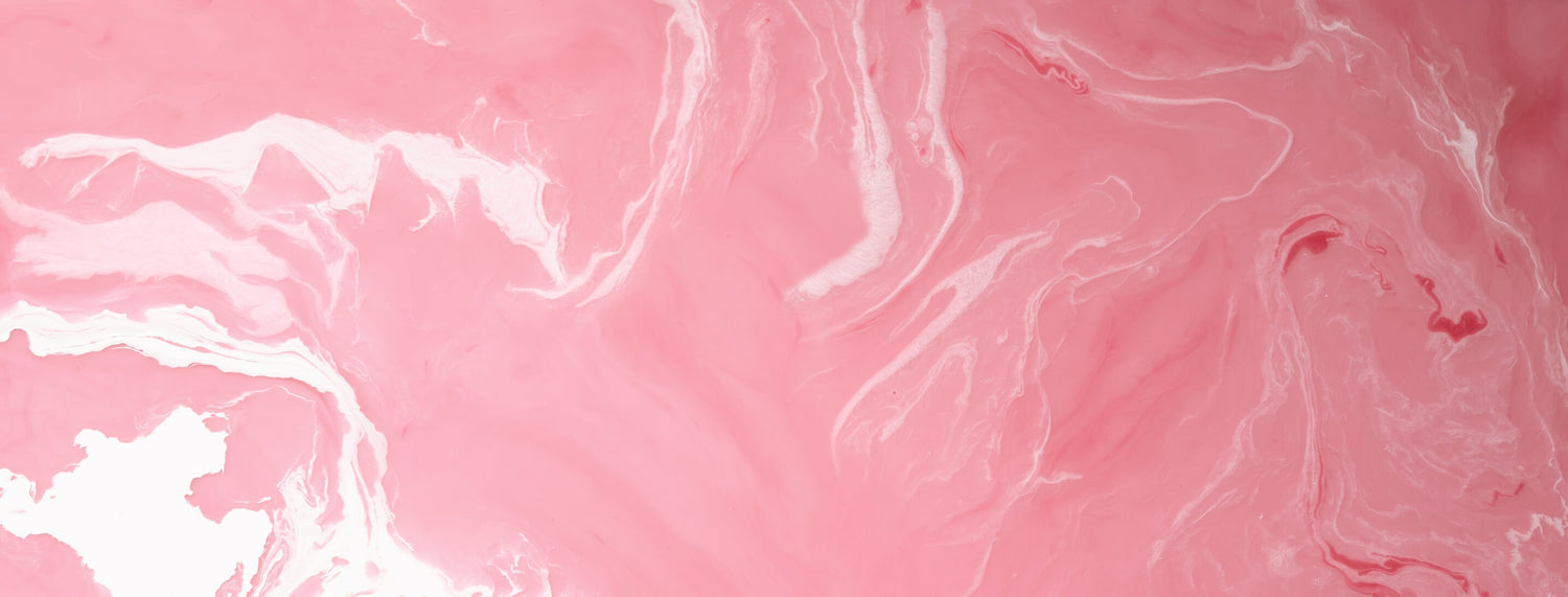 A pink liquid with White swirls