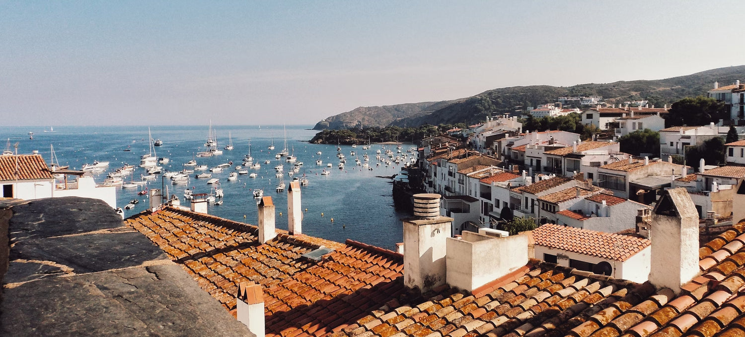 A Mediterranean background with buildings, boats and water