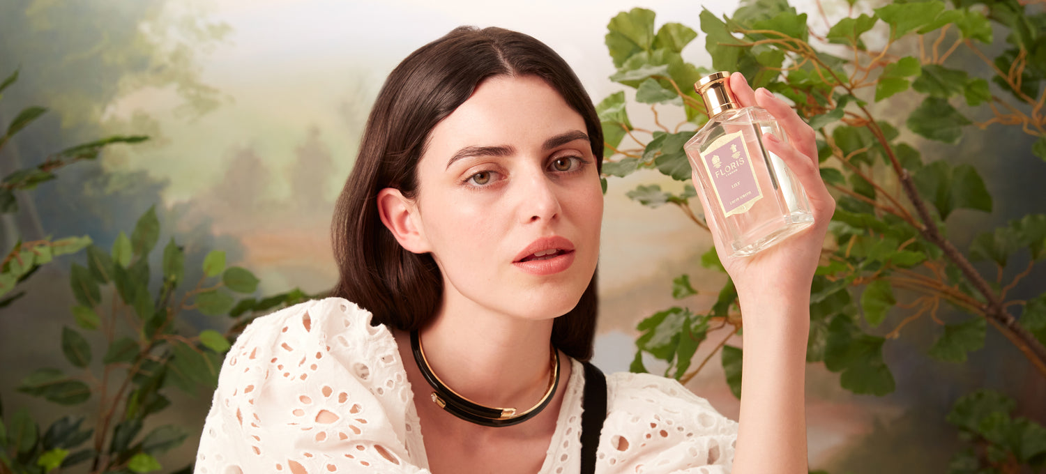 A lady holding a bottle of Lily Eau de Toilette from Floris London