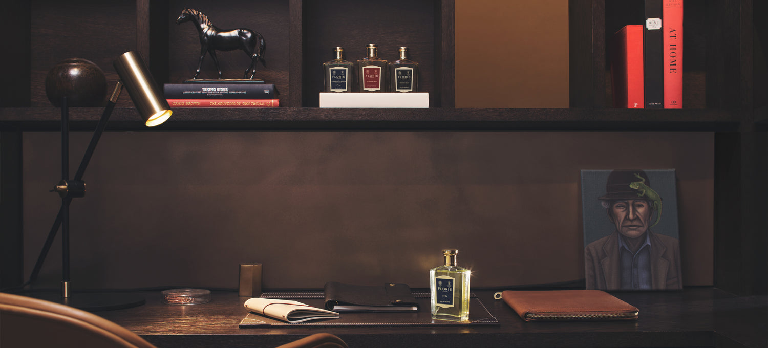 A brown wooden desk background with a bottle of No. 89 Eau de Toilette on the desk