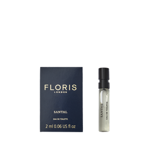 Floris London's Santal Eau de Toilette: a men's sandalwood fragrance in a dark box with gold text and a sleek transparent spray bottle, exuding sophistication.
