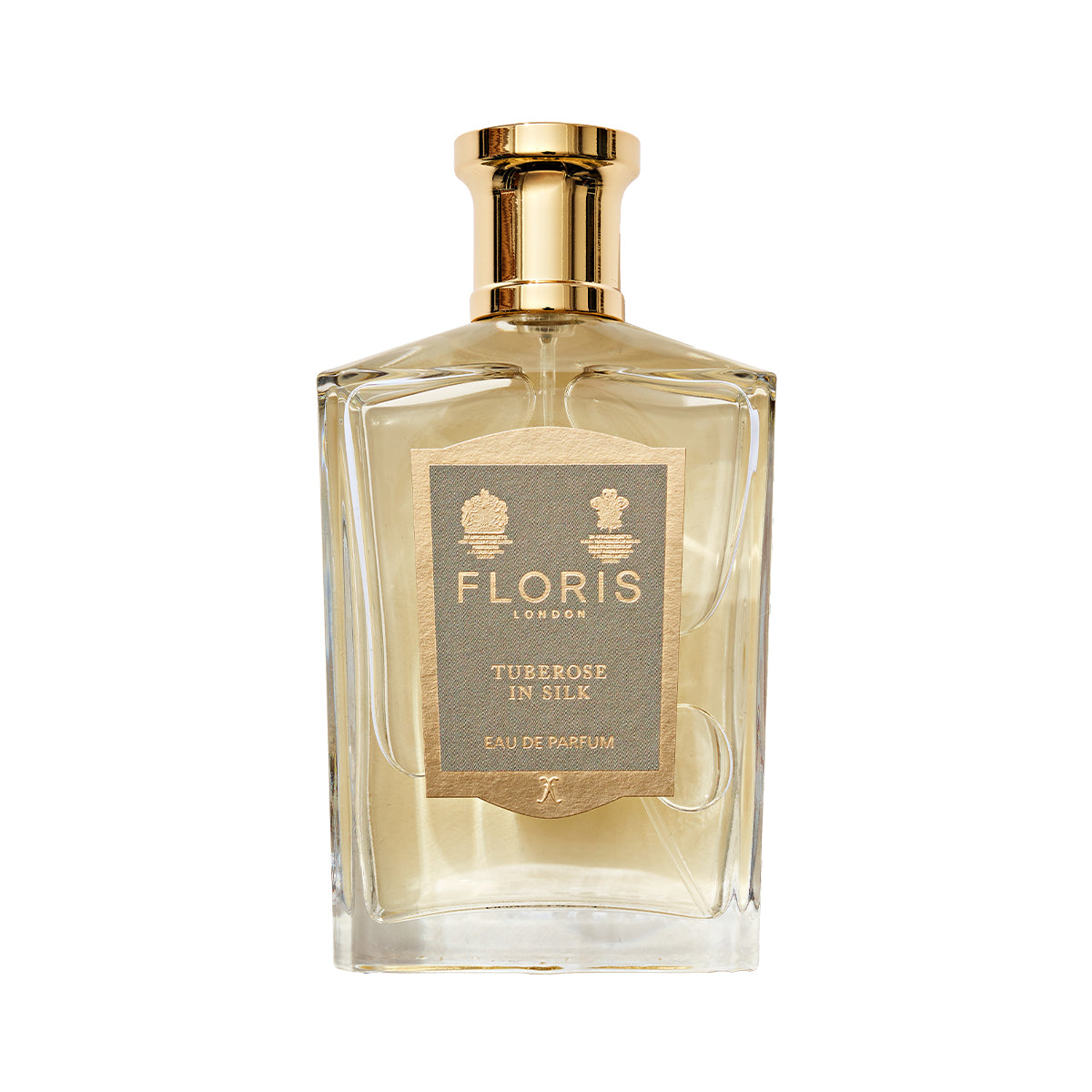 The luxurious "Tuberose in Silk" perfume by Floris London comes in a clear rectangular bottle with a gold cap.