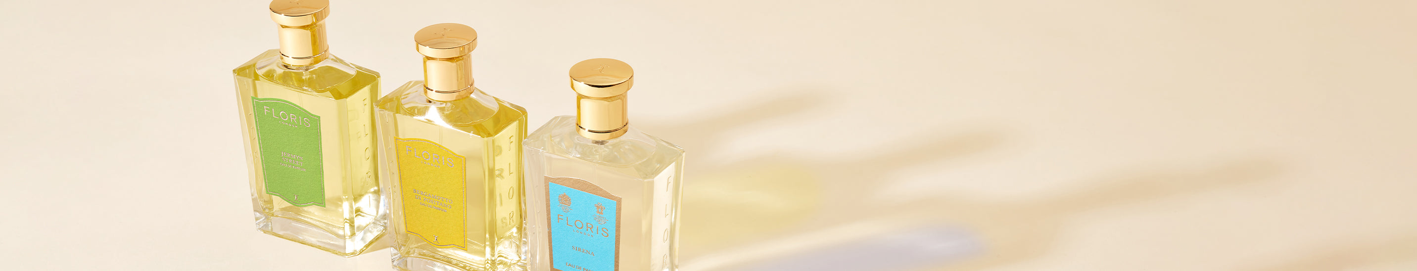 A clear glass fragrance bottle with a pale label, shown upright.