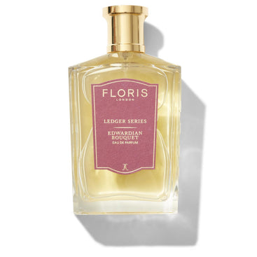 A bottle of Floris London UK Edwardian Bouquet eau de parfum with a gold cap and pink label, featuring delicate notes of ylang-ylang.