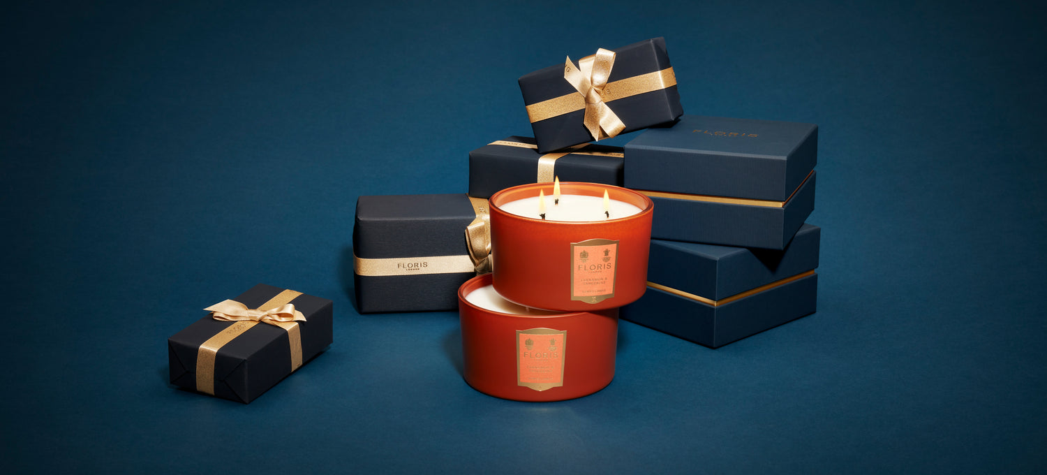 3 wick candle with blue presents behind