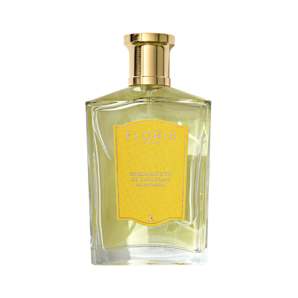 Clear glass bottle of Floris London's Bergamotto di Positano - Eau de Parfum with a gold cap, yellow label, and a hint of bergamot essence.