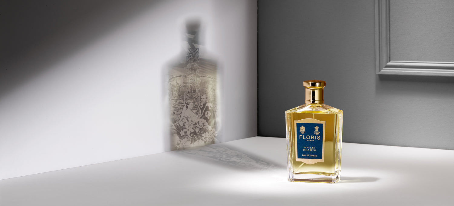 Bottle of Floris London Bouquet De La Reine with a shadow of flowers on the wall behind it