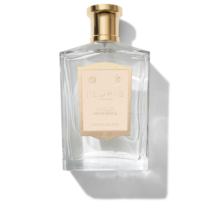 Large Clear glass bottle with gold spray top and golden Bouquet De La Reine label