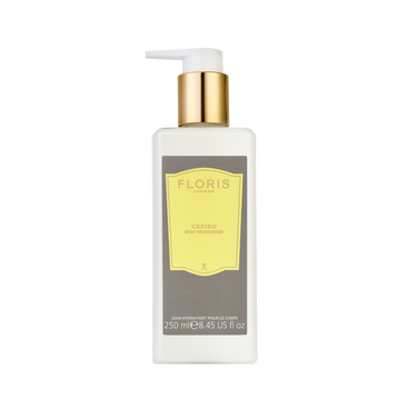 A 250ml white bottle of Floris London Cefiro – Enriched Body Moisturiser features a gold pump, yellow label, and jojoba oil for luxury hydration.