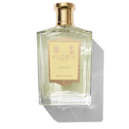 Clear glass bottle with gold atomiser spray top and yellow Cefiro label
