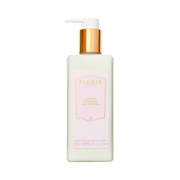 A white bottle of Floris London UK Cherry Blossom - Enriched Body Moisturiser with a gold pump dispenser.