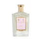 Floris London's Cherry Blossom Eau de Parfum, in a clear glass bottle with a gold cap and pink label, exudes luxury and elegance.
