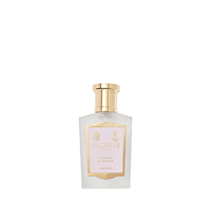 Floris London's Cherry Blossom Hair Mist 50ml comes in a clear glass bottle with gold cap and label, enriched with Panthenol Pro-Vitamin B5.