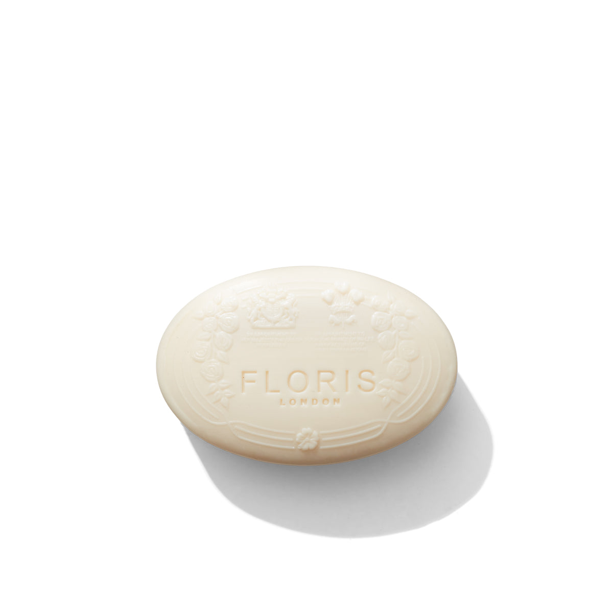 A bar of Floris London Elite Soap, adorned with an embossed floral design on a white background and subtly enhanced with citrus and woody notes.