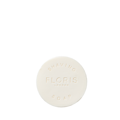 Floris London Elite - Shaving Bowl Refill 100g is a round white soap embossed with the brand, enriched with shea butter for a smooth, woody-scented lather.