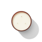 an aerial view of a three wick candle, it is white. 