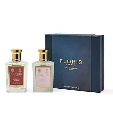 Introducing the Cherry Blossom Duet by Floris London. This exquisite gift set features two perfume bottles elegantly presented in a sophisticated box. One bottle is labeled "Cherry Blossom Intense," offering a rich and vibrant floral experience, while the other embodies the subtle beauty of "Cherry Blossom." This set is perfect for those who appreciate a touch of luxury and floral elegance.