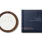 An Elite - Shaving Soap & Bowl from Floris London, enriched with shea butter, sits beside its blue square packaging, both elegantly labeled "The Gentleman Floris.