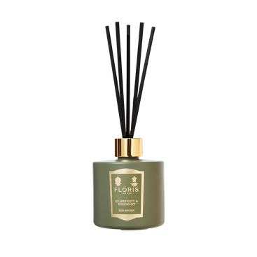 Grapefruit & Rosemary diffuser by Floris London with black reeds, gold label, and notes of sandalwood.
