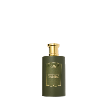Floris London's Grapefruit & Rosemary room fragrance boasts a green bottle, grapefruit and sandalwood scent, and a gold pump top.
