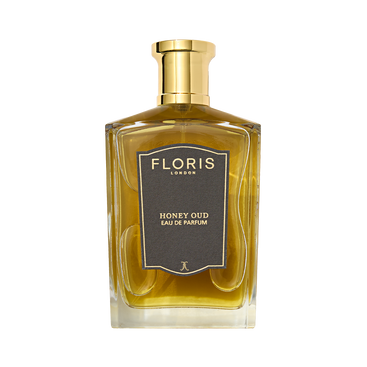 Floris London's Honey Oud Eau de Parfum pairs English honey with oud oil in a clear bottle, topped with a golden cap.