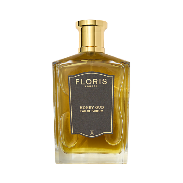 Floris London's Honey Oud Eau de Parfum pairs English honey with oud oil in a clear bottle, topped with a golden cap.