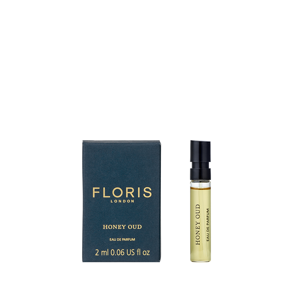 A 2 ml spray vial of Floris London Honey Oud - Eau de Parfum sits beside its black and gold box, both labeled with the brand and fragrance name.