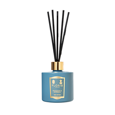 Floris London's Hyacinth & Bluebell - Reed Diffuser (200ml) features a sleek glass vessel with black reeds, filling the air with a green floral fragrance.