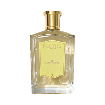A Floris London JF Eau de Toilette bottle features a gold cap and yellow label, offering a citrus-woody fragrance for men.
