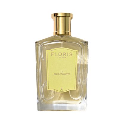 A Floris London JF Eau de Toilette bottle features a gold cap and yellow label, offering a citrus-woody fragrance for men.