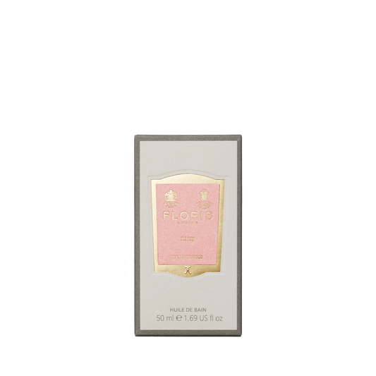 Floris London's Lily Bath Essence, 50 ml, comes in a pink and gold box with a floral lily of the valley fragrance.