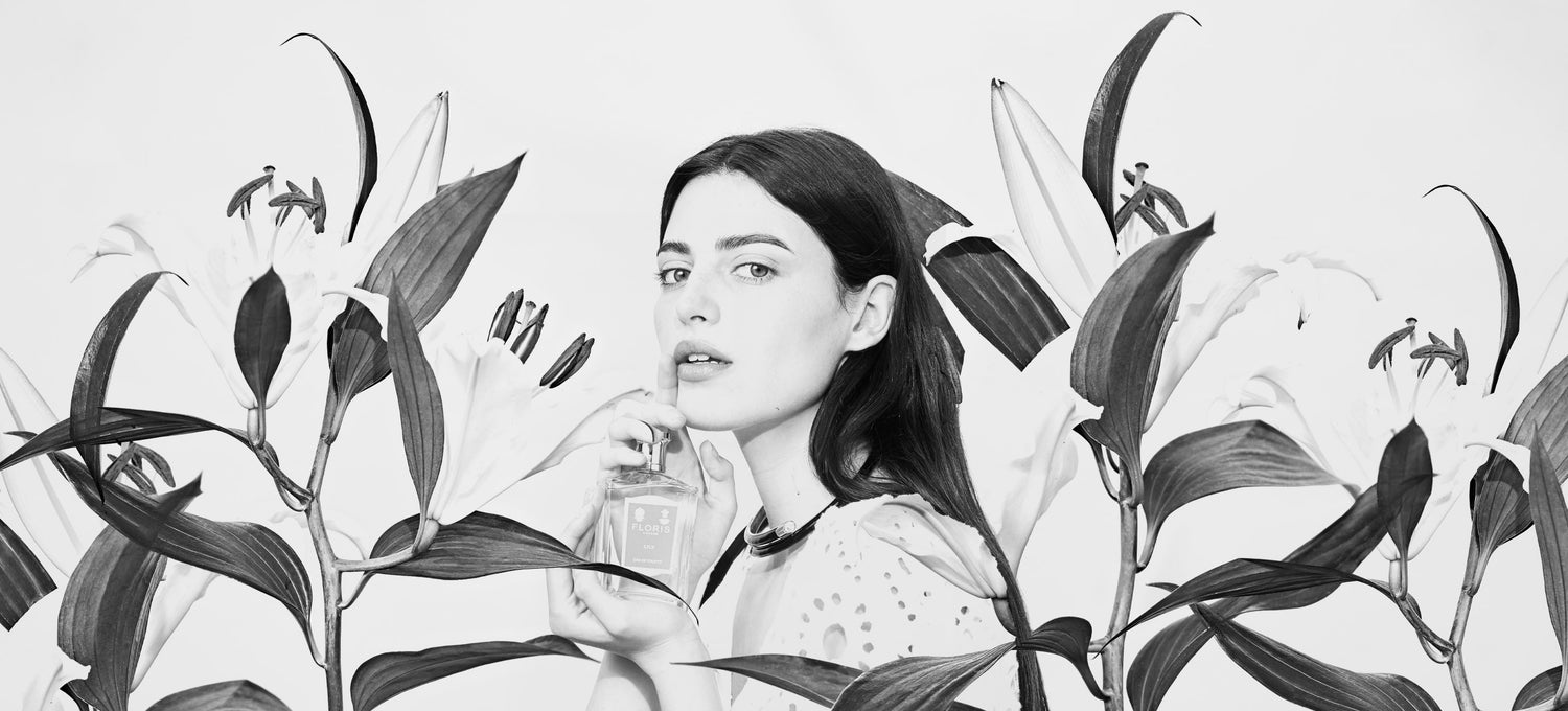 Black and White image of mode surrounded by Lilys
