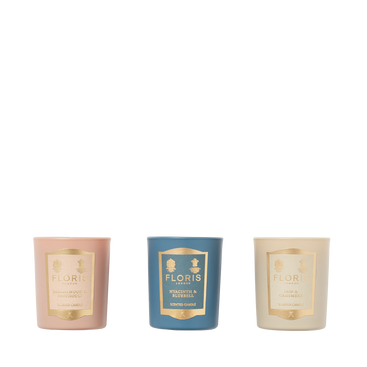 The Miniature Candle Collection by Floris London includes three elegantly labeled, beautifully scented candles in pink, blue, and cream packaging.
