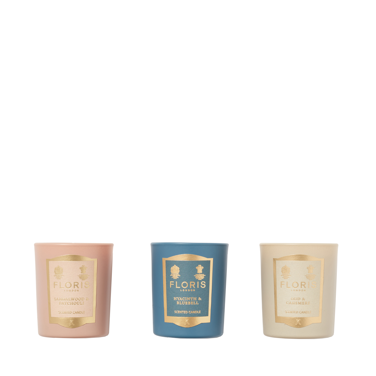 The Miniature Candle Collection by Floris London includes three elegantly labeled, beautifully scented candles in pink, blue, and cream packaging.