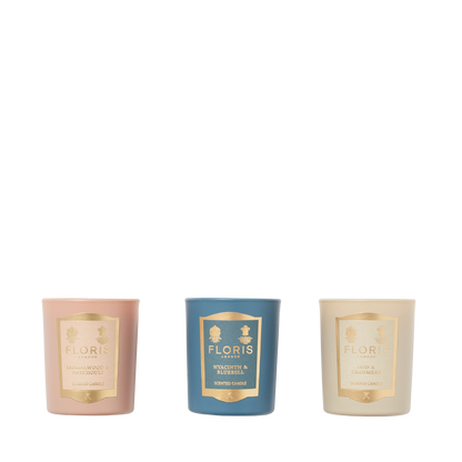 The Miniature Candle Collection by Floris London includes three elegantly labeled, beautifully scented candles in pink, blue, and cream packaging.