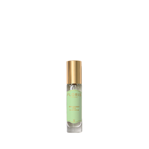 A small bottle of Floris London's Mulberry Fig Eau de Parfum with a green label and gold cap, offering a floral amber fragrance.