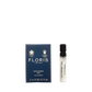 Floris London's Mulberry Fig, a floral amber eau de parfum, is available in a 2ml sample bottle next to its elegant navy box.