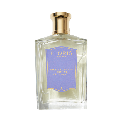 A clear glass bottle of Floris London Night Scented Jasmine Eau de Toilette, with a gold cap and purple label, blending neroli blossom and white jasmine.