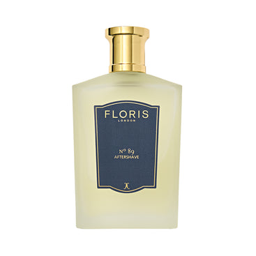 A 100ml bottle of Floris London No. 89 aftershave has a classic cologne scent with sandalwood notes, featuring a gold cap and dark blue label.