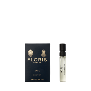 The 2ml spray vial of Floris London's No. 89 Eau de Toilette sits elegantly next to its navy blue box.