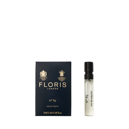 The 2ml spray vial of Floris London's No. 89 Eau de Toilette sits elegantly next to its navy blue box.