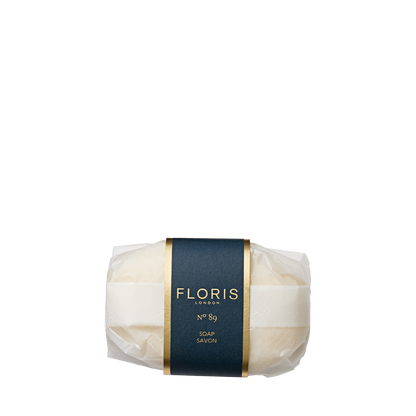 A bar of No. 89 Soap by Floris London, wrapped in translucent paper with an iconic dark blue label.