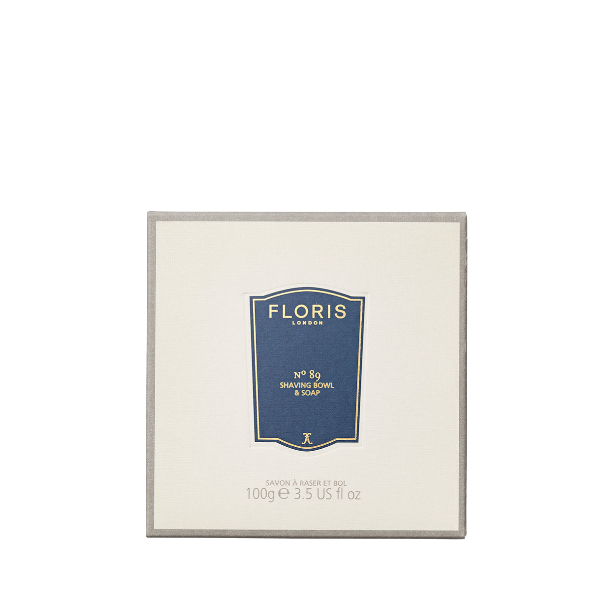 A 100g beige Floris London No. 89 Shaving Soap with shea butter, labeled in blue, perfect for refilling your wooden shaving bowl.