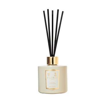 Floris London's Oud & Cashmere Reed Diffuser features a white diffuser with black reeds and a gold cap, blending luxurious Oud and Cashmere scents.