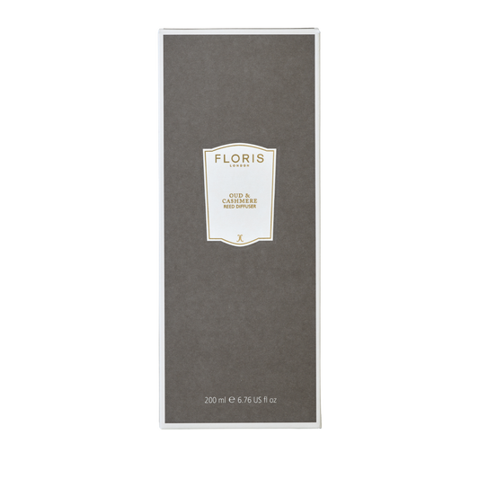 A 200 ml Floris London Oud & Cashmere Reed Diffuser in a rectangular gray box with white borders and gold accents, perfect for home fragrance.