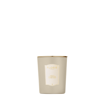 Floris London’s Oud & Cashmere Scented Candle 175g: beige glass with gold rim and cream label—an elegant touch for your home fragrance.